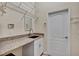 Functional laundry room features granite countertops, cabinets, and practical storage at 9242 Brindlewood Dr, Odessa, FL 33556