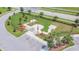 Aerial view of a well-maintained dog park with separate areas for small and large dogs at 9437 Lemon Drop Loop, Sun City Center, FL 33573