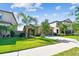 Charming single-story home boasts lush landscaping and a well-maintained lawn at 9437 Lemon Drop Loop, Sun City Center, FL 33573