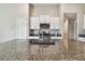 Modern kitchen featuring granite countertops, stainless steel appliances, and ample storage at 9437 Lemon Drop Loop, Sun City Center, FL 33573