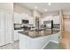 Spacious kitchen with granite countertops, stainless steel appliances, and white cabinetry at 9437 Lemon Drop Loop, Sun City Center, FL 33573