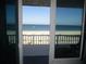 Beachfront view from the balcony, overlooking the sand and ocean at 9980 Gulf Blvd # 408, Treasure Island, FL 33706