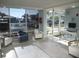 Welcoming lobby with comfortable seating, large windows, and a work station creating a functional space at 9980 Gulf Blvd # 408, Treasure Island, FL 33706