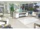 Elegant lobby with modern furniture, decorative plants, mirrors, and contemporary design elements at 9980 Gulf Blvd # 408, Treasure Island, FL 33706