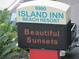 Island Inn Beach Resort sign advertising Beautiful Sunsets on an LED display at 9980 Gulf Blvd # 408, Treasure Island, FL 33706