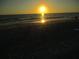 Beautiful sunset over the ocean with the sun's reflection shimmering on the water at 9980 Gulf Blvd # 408, Treasure Island, FL 33706