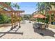 Community area with seating, lounge chairs, landscaping, and pergolas with shade at 100 4Th S Ave # 103, St Petersburg, FL 33701