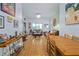 Spacious living room featuring hardwood floors, dining table and comfortable leather sofas at 100 4Th S Ave # 103, St Petersburg, FL 33701