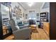 Inviting living room featuring a plush recliner, cozy sofa, and wood-look flooring at 100 4Th S Ave # 103, St Petersburg, FL 33701