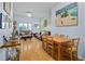 Spacious living room featuring hardwood floors, dining table and comfortable leather sofas at 100 4Th S Ave # 103, St Petersburg, FL 33701