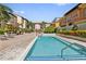 Community pool featuring a paved deck with nearby grilling area at 100 4Th S Ave # 103, St Petersburg, FL 33701