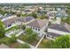 Aerial view of a home with solar panels, a covered patio, and a fenced backyard at 11541 Tangle Branch Ln, Gibsonton, FL 33534