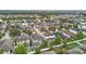 Elevated view of a residential area featuring diverse home styles, well-manicured lawns, and lush landscaping at 11541 Tangle Branch Ln, Gibsonton, FL 33534