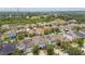 Aerial view of a residential neighborhood with tree-lined streets, well-maintained lawns, and diverse home styles at 11541 Tangle Branch Ln, Gibsonton, FL 33534