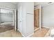 Bright bathroom with tile floors, walk-in shower and doorway to a carpeted bedroom at 11541 Tangle Branch Ln, Gibsonton, FL 33534