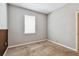 Neutral bedroom with a window allowing natural light and carpeted floors at 11541 Tangle Branch Ln, Gibsonton, FL 33534
