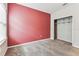 Bedroom with carpet flooring, a window, freshly painted walls, and closet with shelving at 11541 Tangle Branch Ln, Gibsonton, FL 33534
