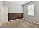 Neutral bedroom with carpeted floors and natural light from a window at 11541 Tangle Branch Ln, Gibsonton, FL 33534