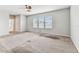 Bedroom featuring a ceiling fan and three large windows for ample natural light at 11541 Tangle Branch Ln, Gibsonton, FL 33534