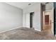 Bedroom features neutral carpet, a closet, and a doorway leading to an adjacent space at 11541 Tangle Branch Ln, Gibsonton, FL 33534