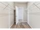 Walk-in closet featuring wire shelving with an open door at 11541 Tangle Branch Ln, Gibsonton, FL 33534