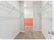 Walk-in closet featuring wire shelving and a view into another closet area at 11541 Tangle Branch Ln, Gibsonton, FL 33534