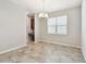 Inviting dining area featuring tile floors, a chandelier, and a window at 11541 Tangle Branch Ln, Gibsonton, FL 33534