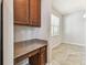 Functional built-in desk and storage near a bright dining area with tile flooring at 11541 Tangle Branch Ln, Gibsonton, FL 33534