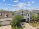 Beautiful two-story home with a well-manicured front yard and attached garage at 11541 Tangle Branch Ln, Gibsonton, FL 33534