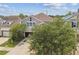Inviting home with a large, shade tree in the front yard and a paved driveway at 11541 Tangle Branch Ln, Gibsonton, FL 33534