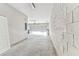 Empty, clean garage with concrete floors and white cinder block wall at 11541 Tangle Branch Ln, Gibsonton, FL 33534