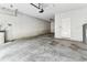 Spacious garage with concrete flooring, ample room for parking and storage at 11541 Tangle Branch Ln, Gibsonton, FL 33534