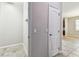 Hallway with a coat rack and a doorway leading to another room at 11541 Tangle Branch Ln, Gibsonton, FL 33534