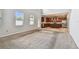 Open-concept living room with a view of the kitchen with a large island and stainless appliances at 11541 Tangle Branch Ln, Gibsonton, FL 33534