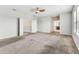 Spacious primary bedroom with an open doorway to a bathroom and a walk-in closet at 11541 Tangle Branch Ln, Gibsonton, FL 33534