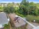 Aerial view of a community playground with swings, slides, and seating at 11541 Tangle Branch Ln, Gibsonton, FL 33534
