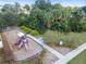Community playground with slides, swings, seating, and sidewalks at 11541 Tangle Branch Ln, Gibsonton, FL 33534