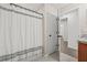 Bathroom with granite countertop, tile flooring, and shower with white curtain at 11551 Brighton Knoll Loop, Riverview, FL 33579