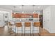 Stylish kitchen with a breakfast bar, granite countertops, stainless steel appliances, and pendant lighting at 11551 Brighton Knoll Loop, Riverview, FL 33579
