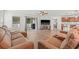 Spacious living room with hardwood floors, a sectional sofa, ceiling fan, and a view of the open concept design at 11551 Brighton Knoll Loop, Riverview, FL 33579