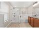 Bright bathroom with separate shower and tub, plus wooden vanity and tiled floors at 11551 Brighton Knoll Loop, Riverview, FL 33579