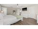 Spacious main bedroom with wood floors, ceiling fan, and en suite bathroom at 11551 Brighton Knoll Loop, Riverview, FL 33579