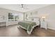 Bright main bedroom with hardwood floors, large windows, and a neutral color palette at 11551 Brighton Knoll Loop, Riverview, FL 33579