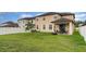 View of the backyard featuring a manicured lawn, fenced perimeter and covered patio at 11918 Winterset Cove Dr, Riverview, FL 33579