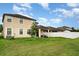 Spacious backyard featuring green grass, a privacy fence and a covered patio at 11918 Winterset Cove Dr, Riverview, FL 33579