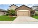Charming two-story home featuring an attached two-car garage and well-maintained landscaping at 11918 Winterset Cove Dr, Riverview, FL 33579