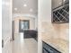 Open concept kitchen with granite countertops, dark cabinets and stainless steel appliances at 11918 Winterset Cove Dr, Riverview, FL 33579