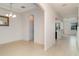 Bright and airy living room featuring neutral walls and tile flooring throughout at 11918 Winterset Cove Dr, Riverview, FL 33579