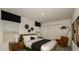 Stylish bedroom with black out curtains, a comfortable bed, and modern accents at 12474 Gust Ct, Hudson, FL 34669