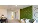 Bright bonus room featuring playful decor, comfortable seating, and ample space for recreation at 12474 Gust Ct, Hudson, FL 34669